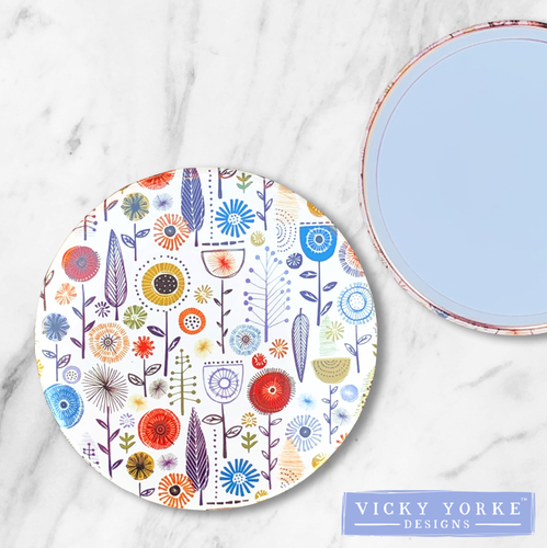 compact-mirror-flowers-woodland