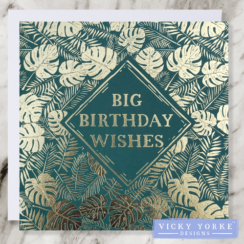 dark green and gold foil greetings card with big birthday wishes sentiment and a pattern featuring fronds, ferns and cheese plant leaves.. 