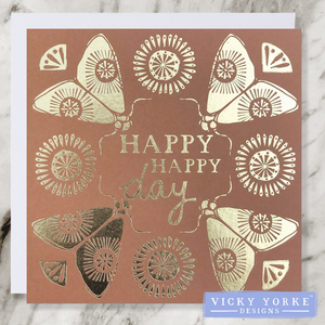 Tan and gold foil greetings card with 'Happy Happy Day' sentiment, with a moth illustration in each corner and sunshine decoration.