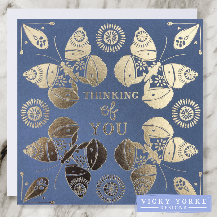Grey and gold foil greetings card with the sentiment 'Thinking Of You' and delicate butterfly / moth illustrations with abstract suns for decoration. 